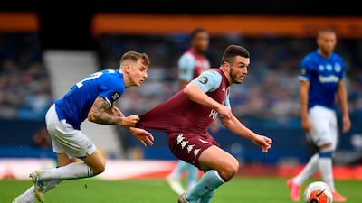 Everton's French defender Lucas Digne vies with Aston Villa's Scottish midfielder John McGinn. AFP