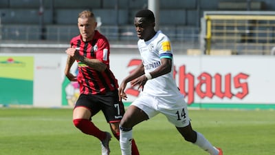 Schalke's Rabbi Matondo, right, has incurred the wrath of supporters after being pictured wearing a shirt of rivals Borussia Dortmund. Reuters