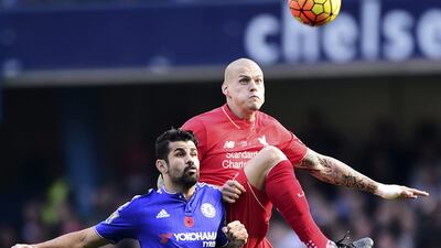 Chelsea’s Diego Costa, left, and Liverpool’s Martin Skrtel compete for the ball. Adam Davy / PA