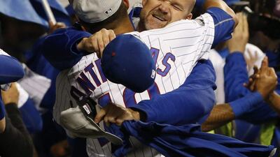 Chicago Cubs catcher Willson Contreras elebrates with catcher David Ross. Nam Y. Huh / AP