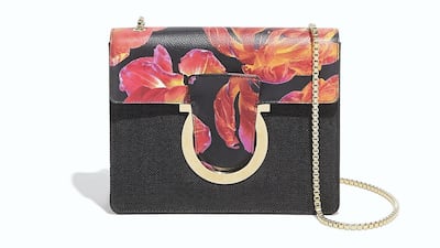 Salvatore Ferragamo: A tidy square black bag is softened with flame-coloured flowers, which wrap over the top and tuck into a gleaming buckle.