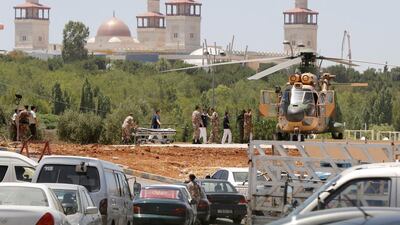 A security member, who was injured during an attack at a camp for Syrian refugees in eastern Jordan near the borders of Iraq, Syria and Jordan, being transported from a military helicopter to Al Hussein Medical Centre in Amman, Jordan on June 21, 2016. Reuters
