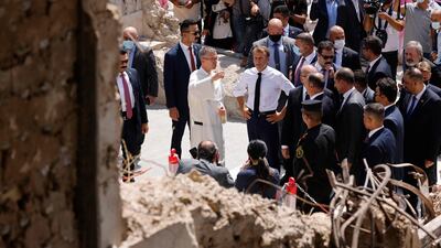 French President Emmanuel Macron tours the Our Lady of the Hour Church in Iraq's second city of Mosul. AFP