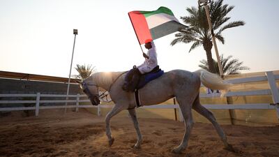 A horse parade to mark Eid Al Etihad, or National Day, at Al Shahama Equestrian Club, Abu Dhabi. Chris Whiteoak / The National