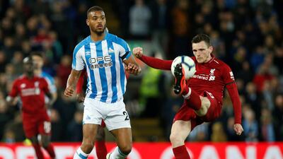 Steve Mounie, left, in action for Huddersfield Town against Liverpool on April 26 during the 2018/19 Premier League season. Reuters