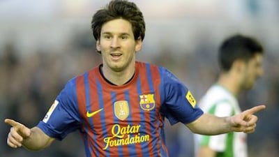Lionel Messi scored both of Barcelona's goals in their 2-0 win over Racing Santander.