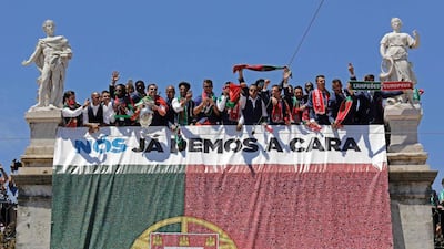 Portugal’s football players gesture on the balcony of the Belem Palace as they celebrate their victory on July 11, 2016 after their Euro 2016 final football win over France yesterday. The Portuguese football team led by Cristiano Ronaldo returned home to a heroes’ welcome today after their upset 1-0 win triumph over France in the Euro 2016 final. AFP / JOSE MANUEL RIBEIRO
