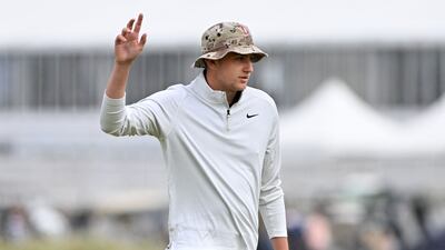 English amateur Barclay Brown reacts to making his birdie putt on the 17th green during his opening-round 68 to finish on four under par. AFP