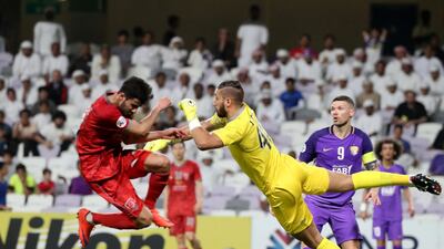 Al Ain's Marcus Berg, right, wasn't on the scoresheet as Qatari club Al Duhail one the first leg of their last-16 Asian Champions League encounter at Hazza bin Zayed Stadium. Karim Sahib / AFP