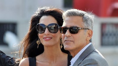 George Clooney and his fiancee Amal Alamuddin. Luigi Costantini / AP Photo