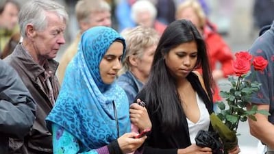 People in front of the Domkirke church in central Oslo, remembering those killed by Anders Behring Breivik.