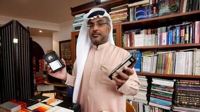 Aqeel al Showab with his film and photograph collection. "It is my happiness," he says.