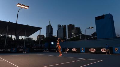 Germany’s Andrea Petkovic serves during her women’s singles match against Russia’s Elizaveta Kulichkova on Day 1 of the 2016 Australian Open in Melbourne on January 18, 2016. William West / AFP