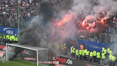 HSV supporters light flares during the German Bundesliga soccer match between Hamburger SV and Borussia Moenchengladbach in Hamburg, Germany, on May 12, 2018. David Hecker / EPA