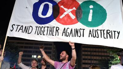 Greek voters hold a banner reading ‘No’ in front of the parliament in Athens. Louisa Gouliamaki / AFP