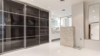 The mezzanine level has the main bedroom, a walk-in closet and a bathroom. Courtesy Luxhabitat