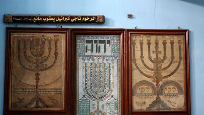 Framed scriptures and images in a Baghdad synagogue.