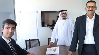 From left: Enrico Villa, the director of enterprise development and innovation at TDC; Omar Al Tamimi, a board member at Green Nanotek; and Professor Yousef Haik, of the Department of Mechanical Engineering at the UAE University. Delores Johnson / The National