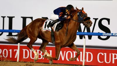 Joel Rosario rides Mind Your Biscuits to the finish line to win the Dubai Golden Shaheen at Meydan Racecourse on Saturday. Ahmed Jadallah / Reuters