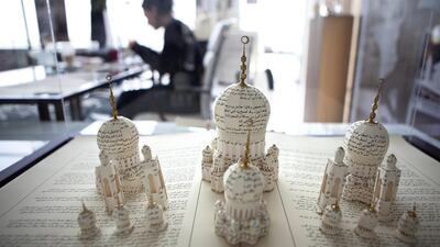 British paper sculpture artist Su Blackwell, 37, an artist in residence with the Fairmont Bab Al Bahr hotel, works on the model on at the hotel in Abu Dhabi in 2013. Silvia Razgova / The National