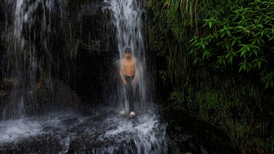 A boy cools off under a waterfall on the outskirts of Sowari, in Khyber Pakhtunkhwa province, Pakistan. Reuters