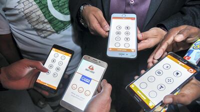 November 23, 2017. Abu Muadh (center) wants to help blue collar workers better their lives and is doing so with a mobile app that teaches them English language and also gives them educational, safety information in the language they are comfortable. Victor Besa for The National National Reporter: Ramola Talwar