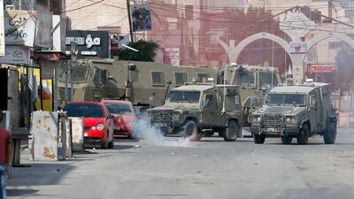 Israeli armoured vehicles during the army operation at the refugee camp near the West Bank city of Jenin on Saturday. EPA
