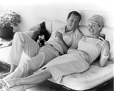 Doris Day (R) relaxing with US actor Rock Hudson (L). Photo: AFP