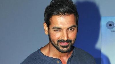 John Abraham poses during a press meeting. AFP