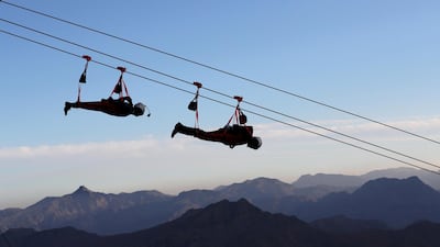 People ride the world's longest zip-line over Ras al-Khamiah's Jabal Jais Mountain, UAE January 31, 2018. Picture taken January 31, 2018.