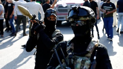 Iraqi Popular Mobilisation Forces (Hashid Shaabi) are seen at a march during the funeral of members of Shi'ite group Asaib Ahl Al Haq, who were killed when protesters attacked the group's office during anti-government protests, in Baghdad, Iraq October 26, 2019. Reuters
