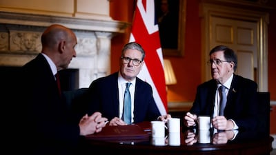 Britain's Prime Minister Keir Starmer meets with Britain's Defence Secretary John Healey and defence review chief George Robertson on Tuesday