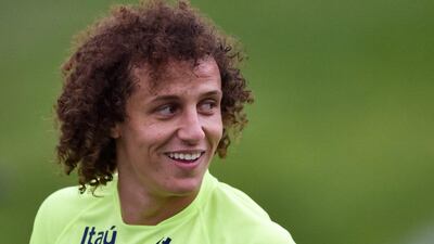 David Luiz smiles during a training session for Brazil on Friday during the 2014 World Cup. Buda Mendes / Getty Images / June 20, 2014