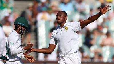South Africa's Kagiso Rabada, right, celebrates with a teammate after dismissing Australia's Usman Khawaja. AP