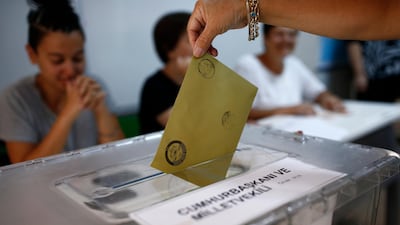 A woman casts her ballot at a polling station in Ankara, Turkey, on June 24, 2018. Burhan Ozbilici / AP Photo