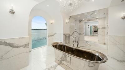 Master bathrooms are fitted with sunken bath tubs and rain showers. Courtesy Sotheby’s International Realty