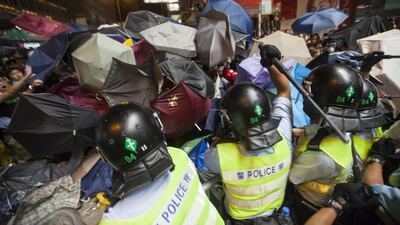 Authorities had earlier managed to repel protesters from a major intersection but later faced a significant pushback. Alex Hofford/EPA