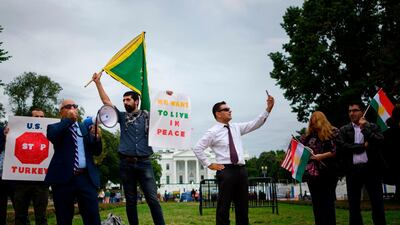 Protesters demonstrate against US President Donald Trump's decision to withdraw US troops from northeastern Syria in front of the White House in Washington. AFP