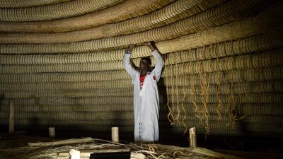 An artisan at work on the ceiling.