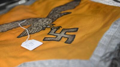 A Nazi flag with an eagle and a swastika is one of several hundred Nazi objects that went up for auction. Reuters