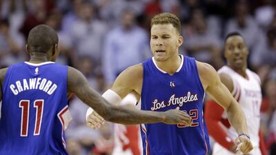 Los Angeles Clippers forward Blake Griffin celebrates with teammate Jamal Crawford during their Game 1 win in the NBA play-offs second round series against the Houston Rockets on Monday night. David J Phillip / AP / May 4, 2015