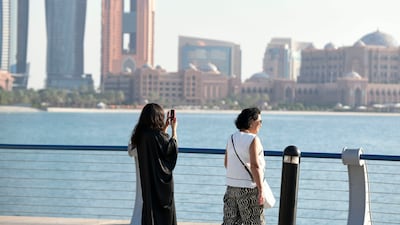 Tourists at the Corniche in Abu Dhabi. The UAE's non-oil sectors have been expanding in recent years. Khushnum Bhandari / The National
