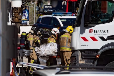 A covered stretcher is carried from the nightclub in Murcia. EPA