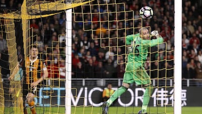Hull City's Harry Maguire scores their fourth goal as Middlesbrough's Victor Valdes looks on. Hull won 4-2. Carl Recine / Reuters