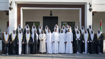 Sheikh Nahyan bin Mubarak, Minister of State for Tolerance, Sheikh Tahnoon bin Mohammed, Ruler's Representative in Al Ain Region, Ahmed Al Zaabi, Jaber Al Suwaidi, Sheikh Diab bin Tahnoon (8th L) and Sheikh Mohammed bin Nahyan (10th L), stand for a photograph during a mass wedding held at Majlis Al Manhal. Hamad Al Kaabi / Ministry of Presidential Affairs