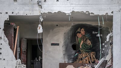 A mural by Palestinian artists, part of an exhibition entitled 'Occupation Kills Childhood' on houses damaged during Israel and Islamic Jihad fighting in Gaza, in Deir Al Balah town, central Gaza Strip. EPA