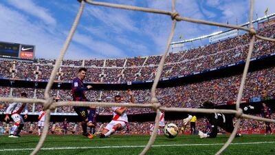 The largest crowd to ascend on Camp Nou this season witnessed a hat trick from Lionel Messi as Barcelona climbed atop the Primera Liga on Sunday. David Ramos / Getty Images