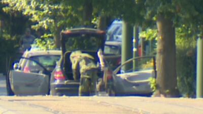 A bomb disposal expert searches a car in the Brussels' commune of Woluwe St Pierre on June 30, 2018. Reuters TV
