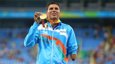 India's Devendra Jhajaria poses at the podium after receiving the gold medal for men's Javelin throw after setting a new world record at the Rio 2016 Paralympic Games on September 13 in Rio de Janeiro, Brazil. Lucas Uebel/Getty Images