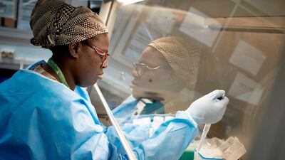 A Malian researcher conducts a coronavirus test, in the laboratory of the "Point G" hospital in Bamako. AFP